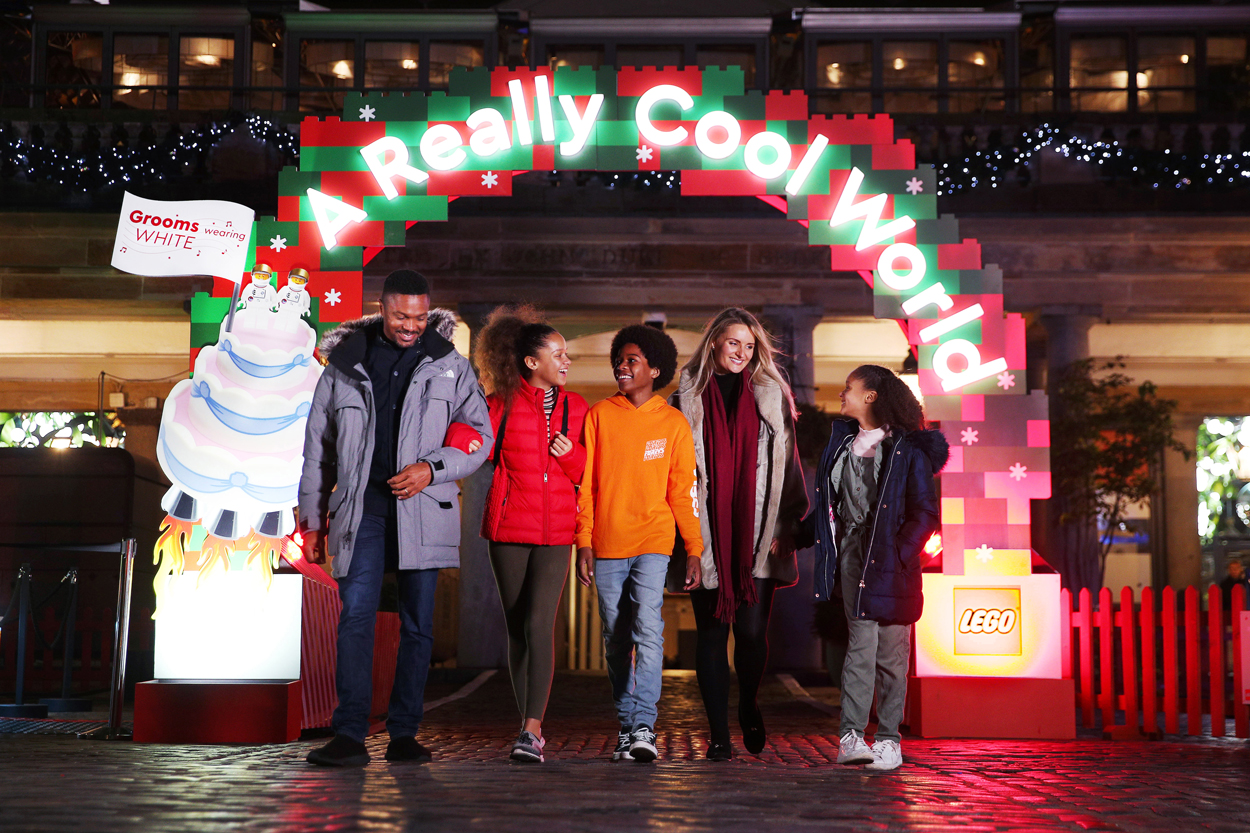 People walkiong through the installation
